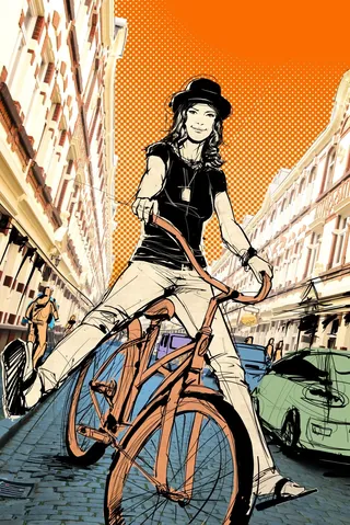 Person riding bicycle on city street by Jan Meininghaus