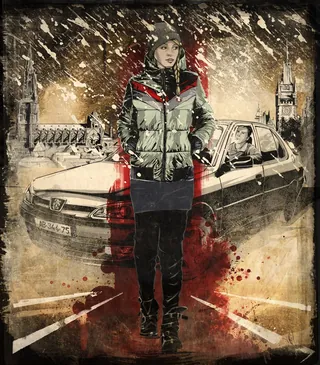 Woman in winter jacket standing near a car in city street by Jan Meininghaus