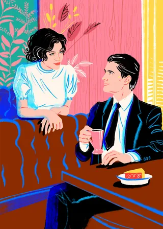 Couple chatting at cafe table with drink and pastry by Jessine Hein