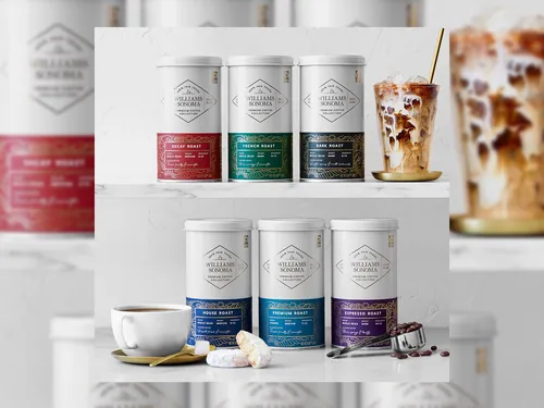Stacked coffee creamer cans with cup and iced coffee by Joseph Carrington