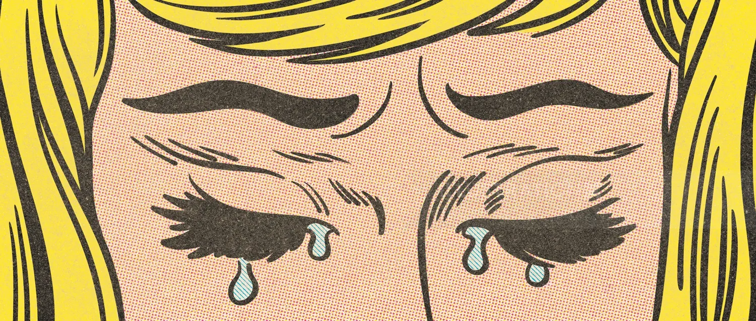 Close-up of a woman crying with tears on her cheeks