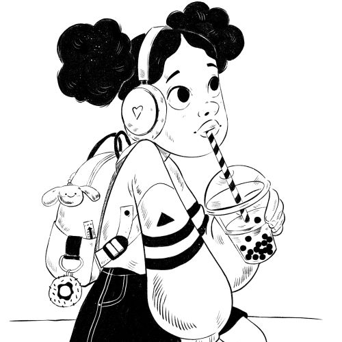 Girl with headphones sipping bubble tea through a straw