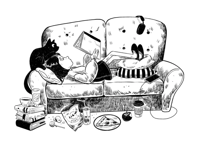 Girl lying on couch reading book with cat and snacks nearby