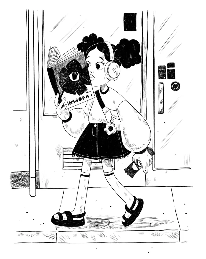 Young girl with headphones reading book at subway station platform