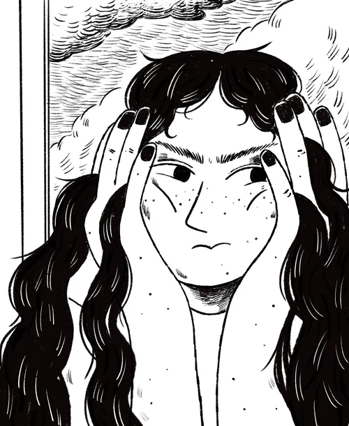 Person with long hair holding hands to face, looking thoughtful