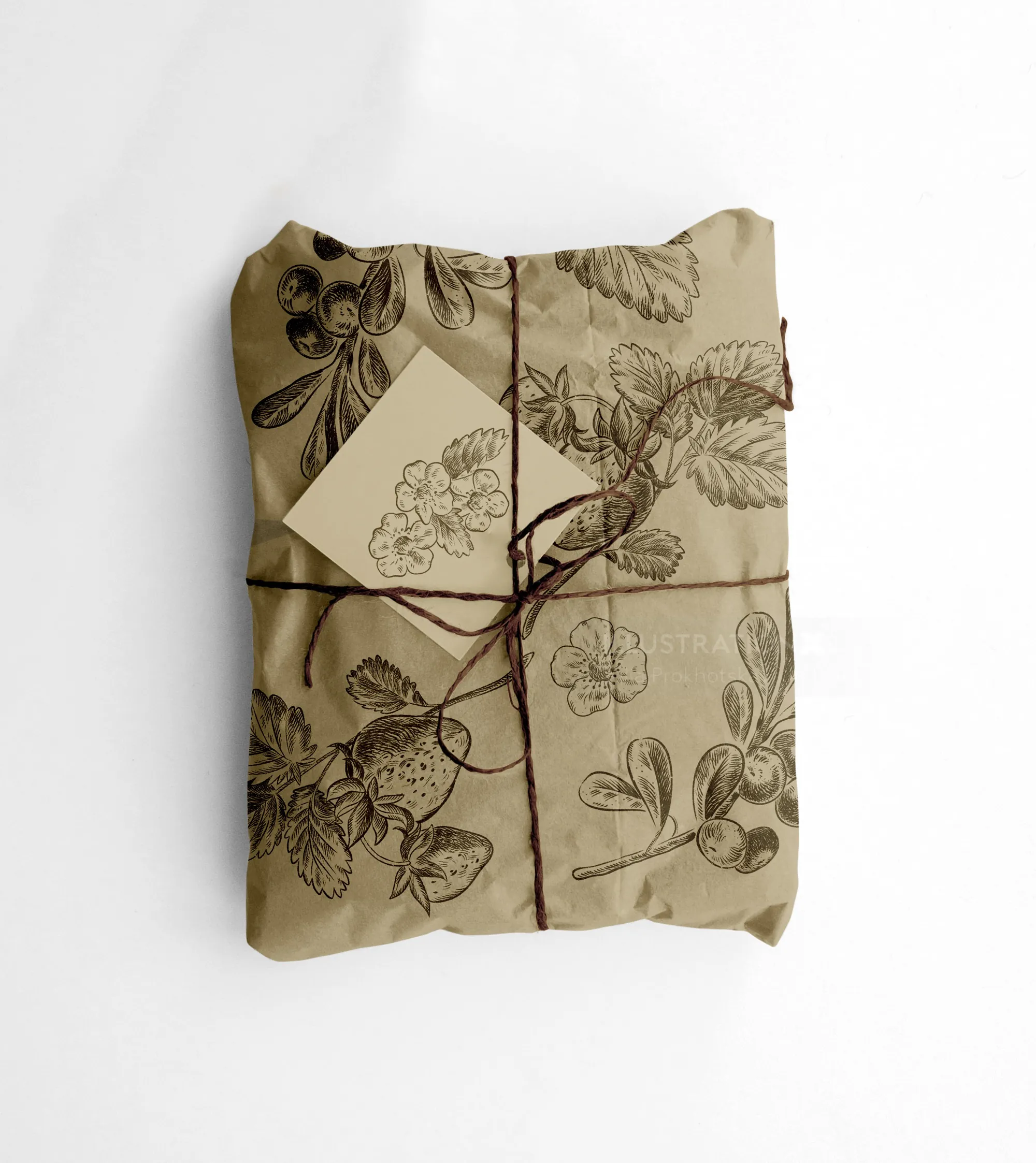 Package wrapped in botanical print paper tied with twine and tag