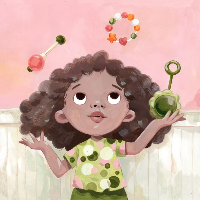Curly-haired girl joyfully juggling colorful toys on pink backdrop