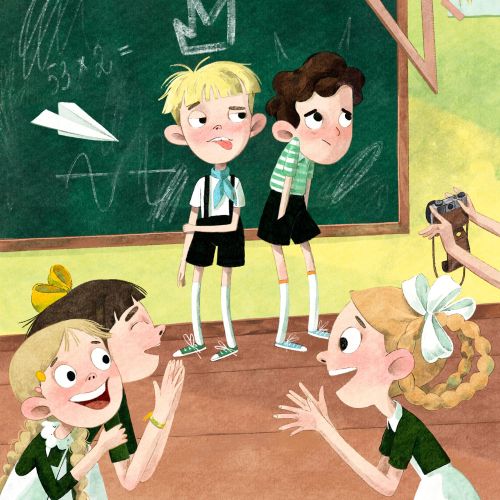 Two boys on stage with classmates taking pictures and applauding.