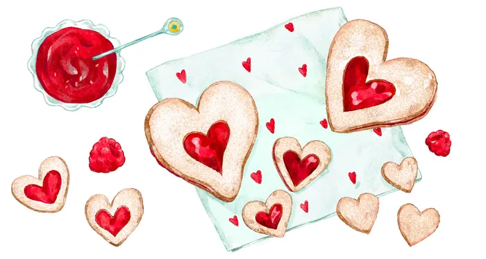 Heart-shaped cookies with red jam and a bowl of jam on napkin