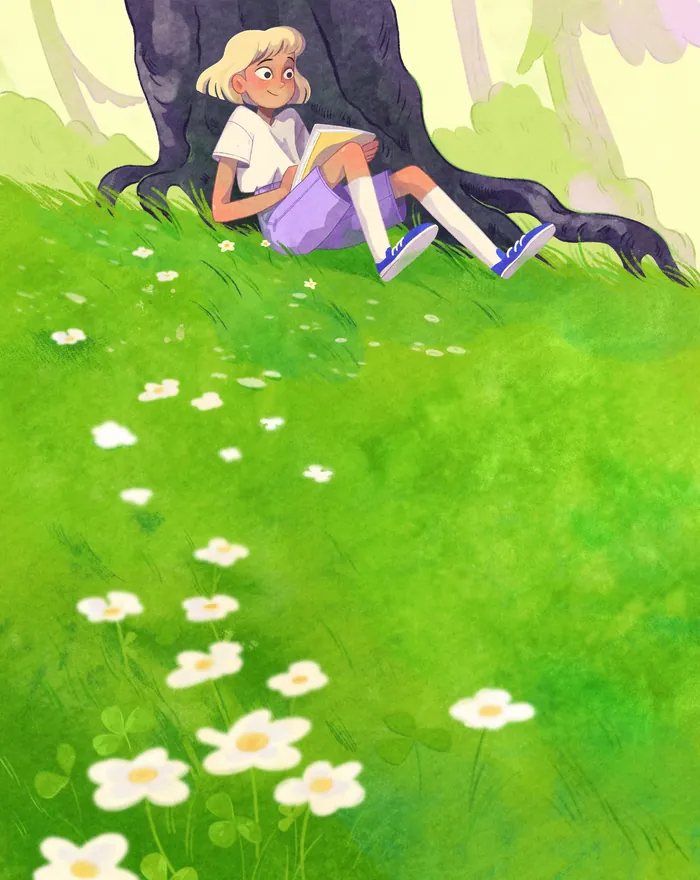 Young girl reading book under tree on green grassy field with white flowers