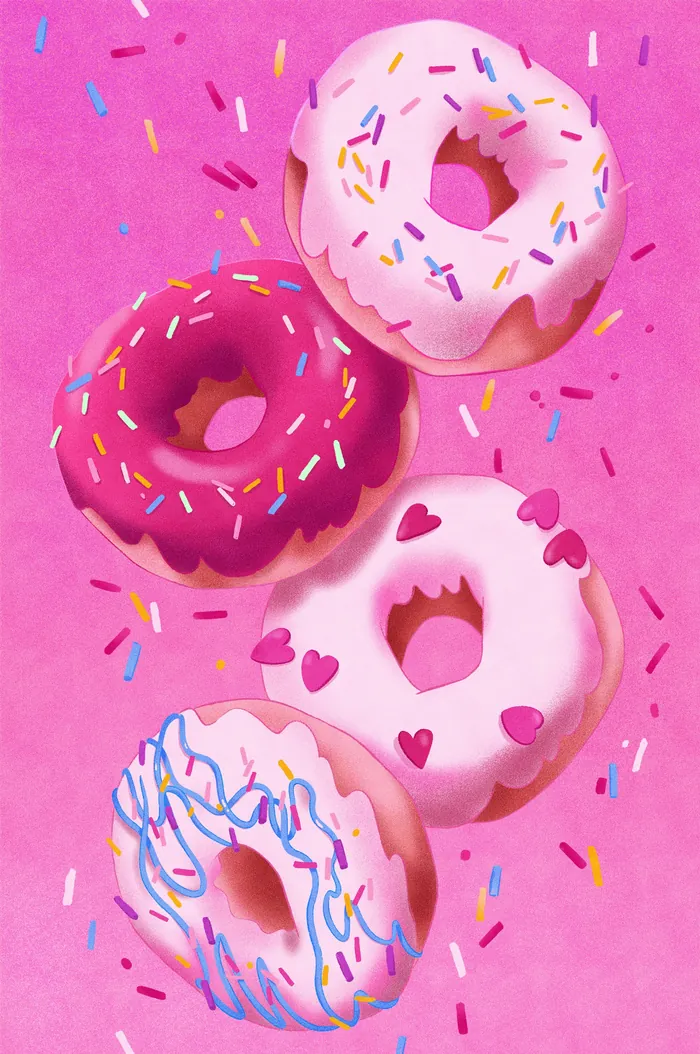 Four donuts with pink, white, and purple icing and sprinkles
