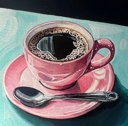 Pink coffee cup filled with black coffee on saucer with spoon