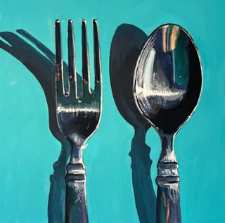 Fork and spoon with shadows on a turquoise background