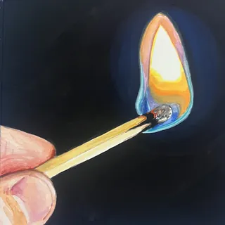 Hand holding a lit matchstick with bright flame against dark background