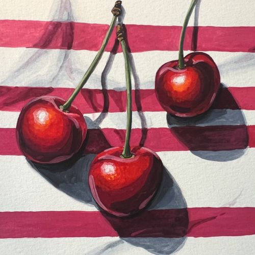 Three red cherries with stems casting shadows on striped red and white background