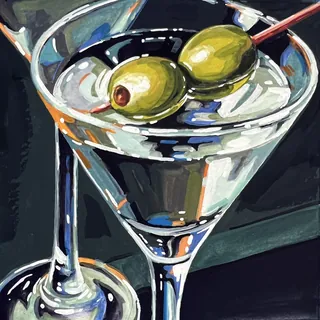 Martini glass with two green olives on a cocktail stick