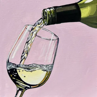 White wine pouring into a tilted glass with bubbles and pink background