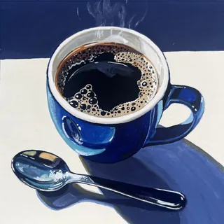 Blue mug filled with black coffee and a spoon on the side