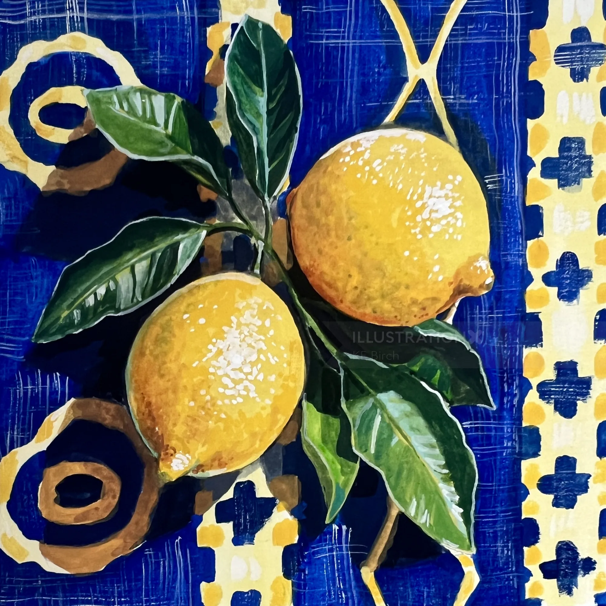 Two ripe yellow lemons with green leaves on a decorative blue and yellow surface