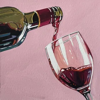 Red wine pouring from bottle into a glass