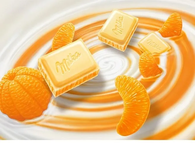 Milka chocolate squares with mandarin slices on creamy swirl by Kai Klimiont