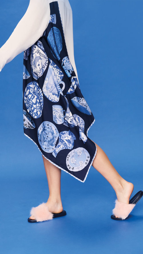 The Pottery night shirt features hand drawn blue and white vases, plates and object.