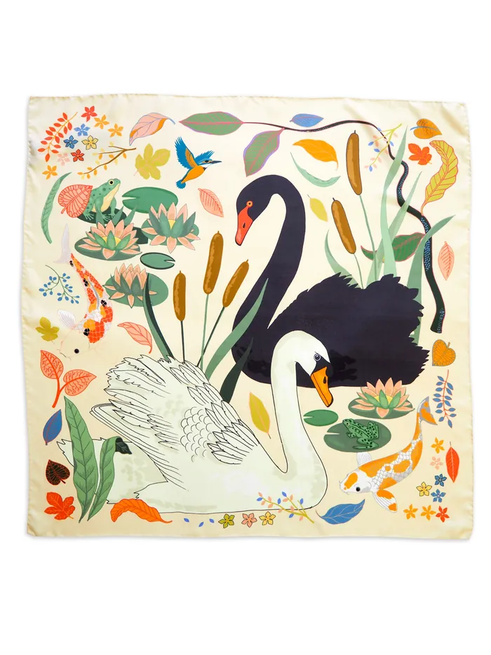 Black and white swans in a pond with plants and fish by Karen Mabon