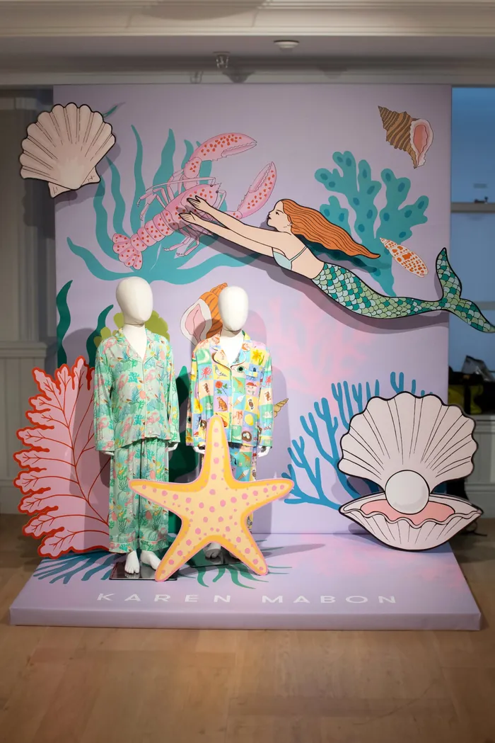 Mannequins in pajamas with mermaid and sea life backdrop