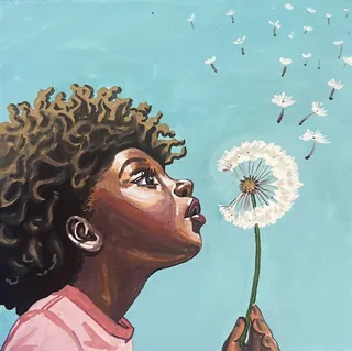 Child blowing dandelion seeds against a blue sky