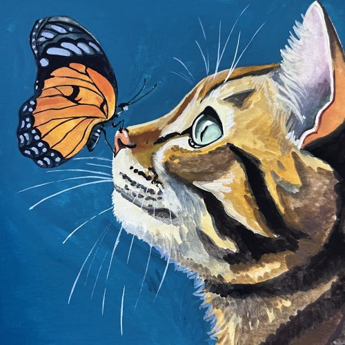Close-up of a cat looking at a monarch butterfly