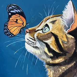 Close-up of a cat looking at a monarch butterfly