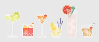 Colorful cocktail drinks with garnishes and ice cubes by Kate Snell