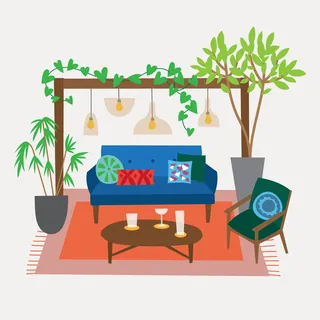 Cozy living room with blue sofa, green armchair, coffee table, and plants by Kate Snell