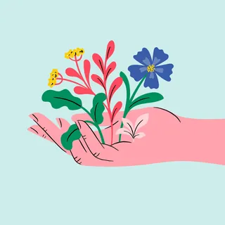 Hand holding yellow and blue flowers with green leaves