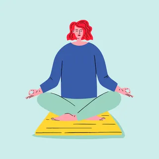Person with red hair meditating cross-legged on yellow mat