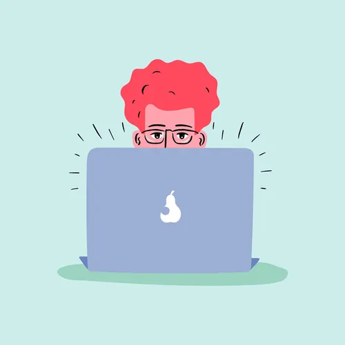 Person with red hair and glasses peeking over laptop
