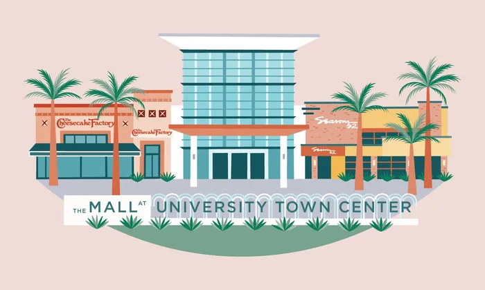Mall at University Town Center storefronts with palm trees and clear sky