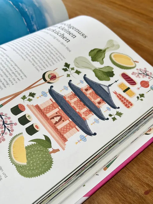 Illustrated open book page with fish and plants by Kate Snell