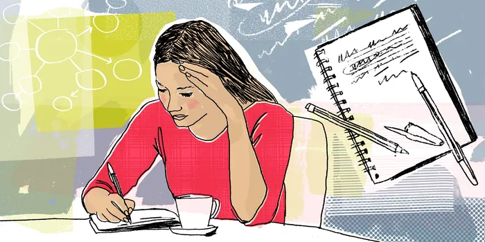 Woman writing notes at table with coffee cup and notebook by Kavel Rafferty