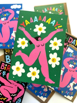 Bright pink figure jumping with flowers and Yaaaaaay text