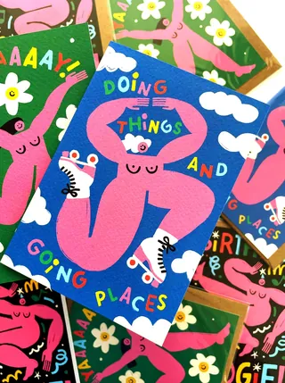 Colorful cards with pink cartoon figures and motivational text