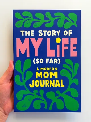 Book cover of The Story of My Life (So Far): A Modern Mom Journal with colorful text and green leaf 