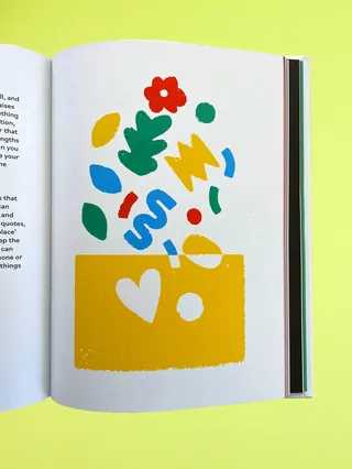 Colorful abstract shapes emerging from a yellow block on book page