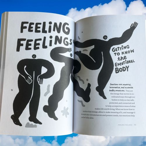 Open book showing black and white abstract figures with emotional body text