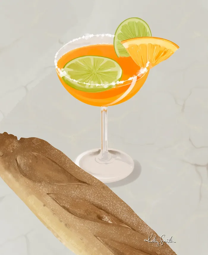 Cocktail glass with orange and lime slices on rim
