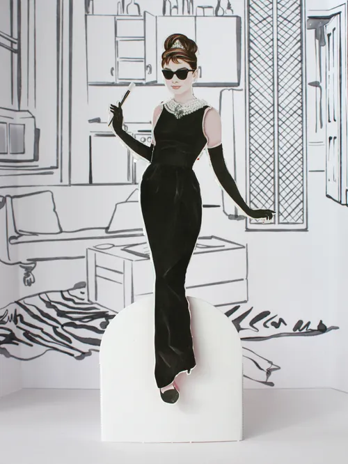 Illustration of Audrey Hepburn paper doll in black dress by Kelly Smith