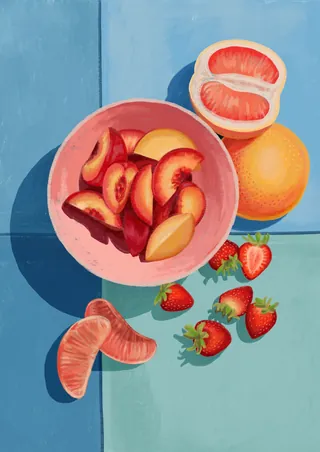 Bowl of sliced plums and nectarines with strawberries and orange segments