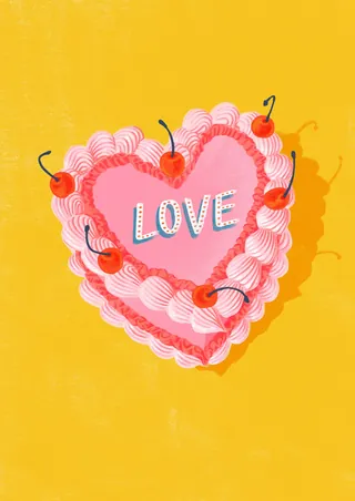 Heart-shaped pink cake with cherries spelling love