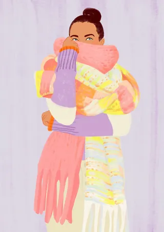 Woman wearing multiple colorful scarves and sweaters