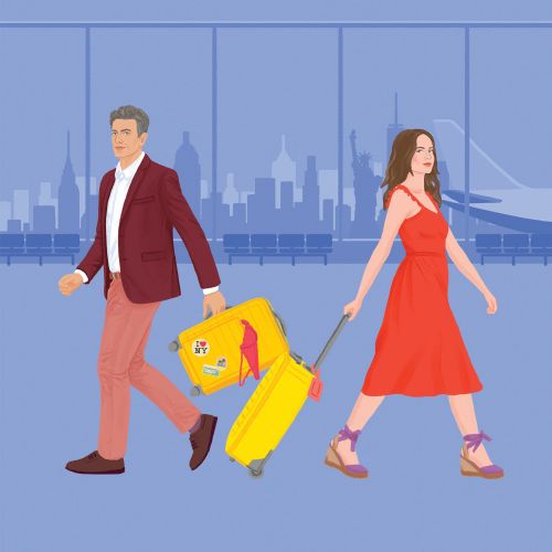 Man and woman walking with yellow suitcase in airport terminal